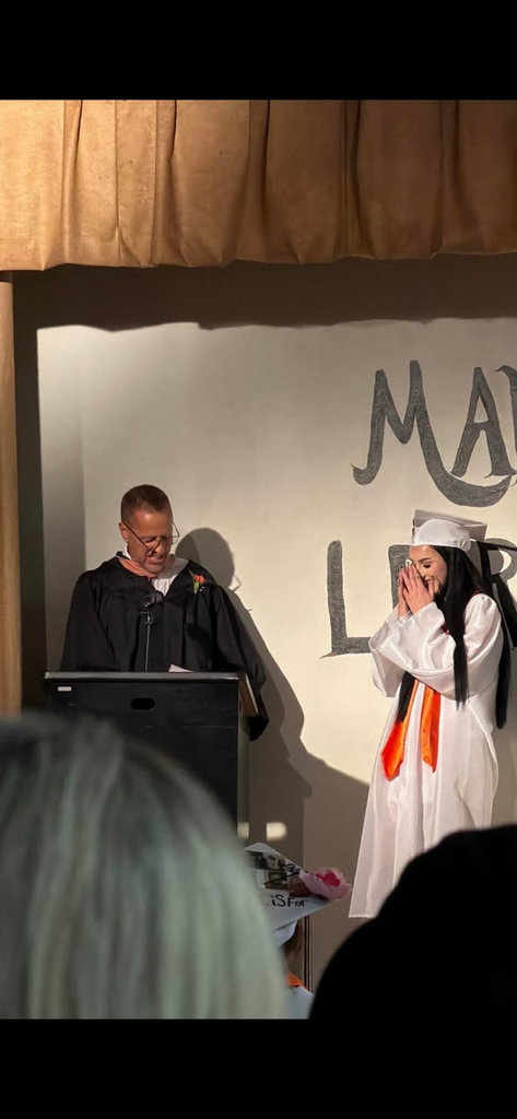 Tessa covering he r mouth in surprise getting her scholarship