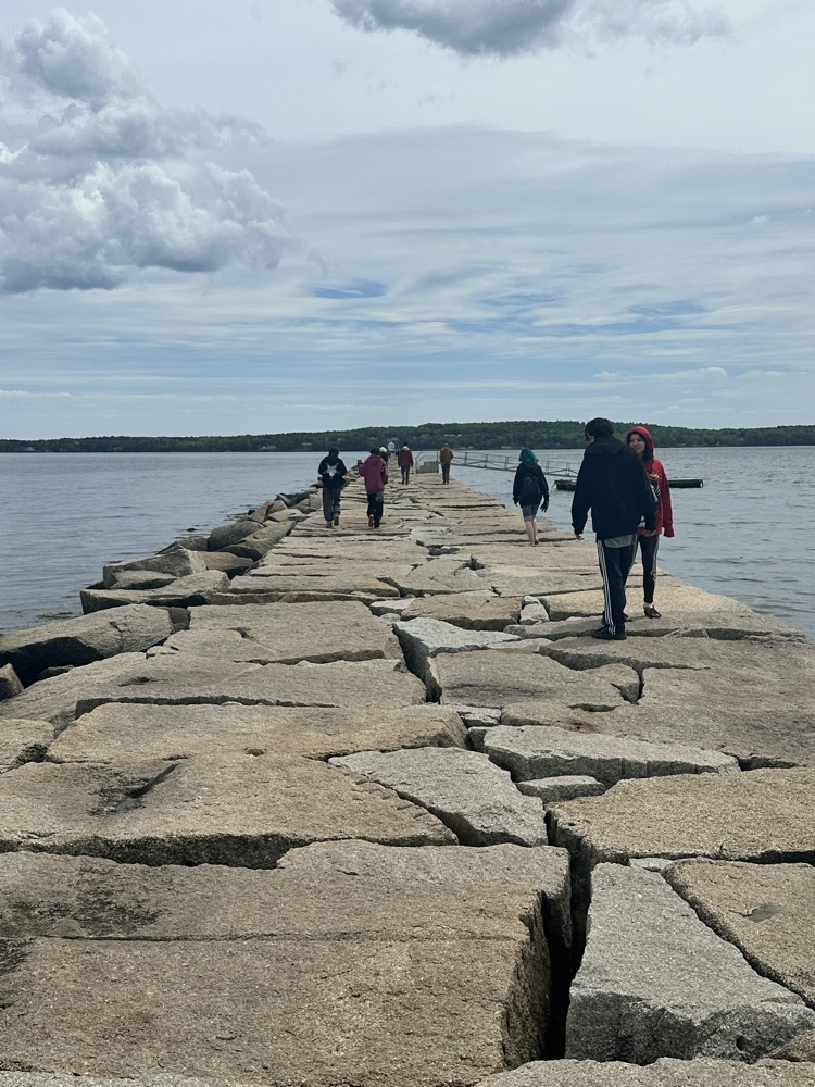 students walking the rockland breakwater