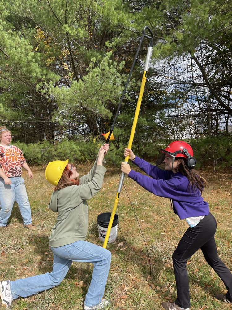 students using the slingshot of invasive species