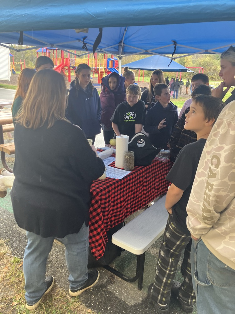 students making butter at the flood farm demo