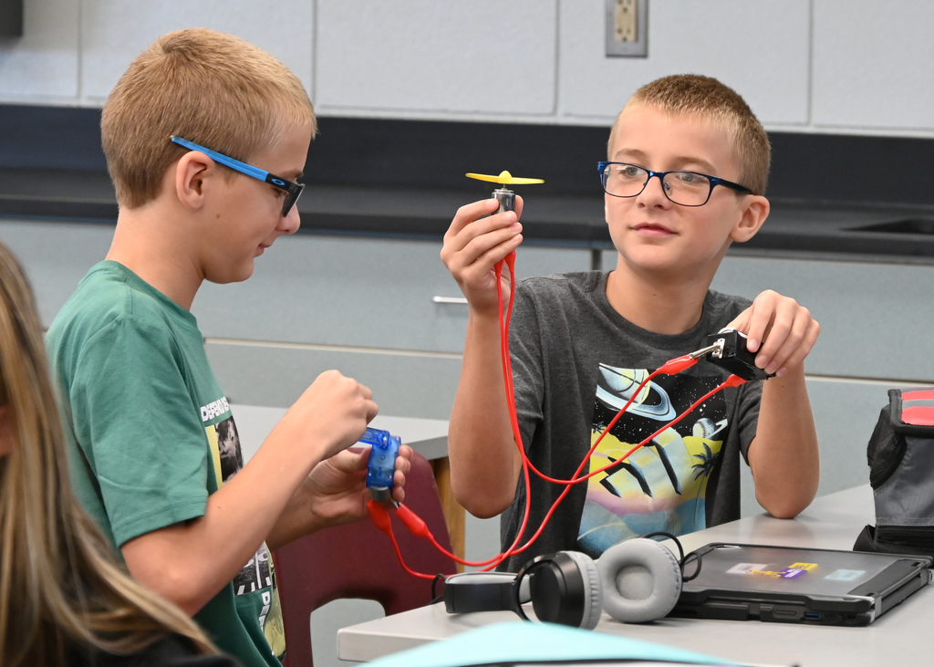 students working with circuits at a desk