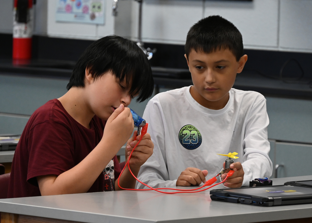 students working with circuits at a desk