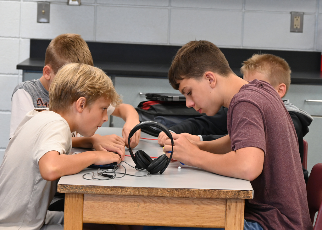 students working with circuits at a desk