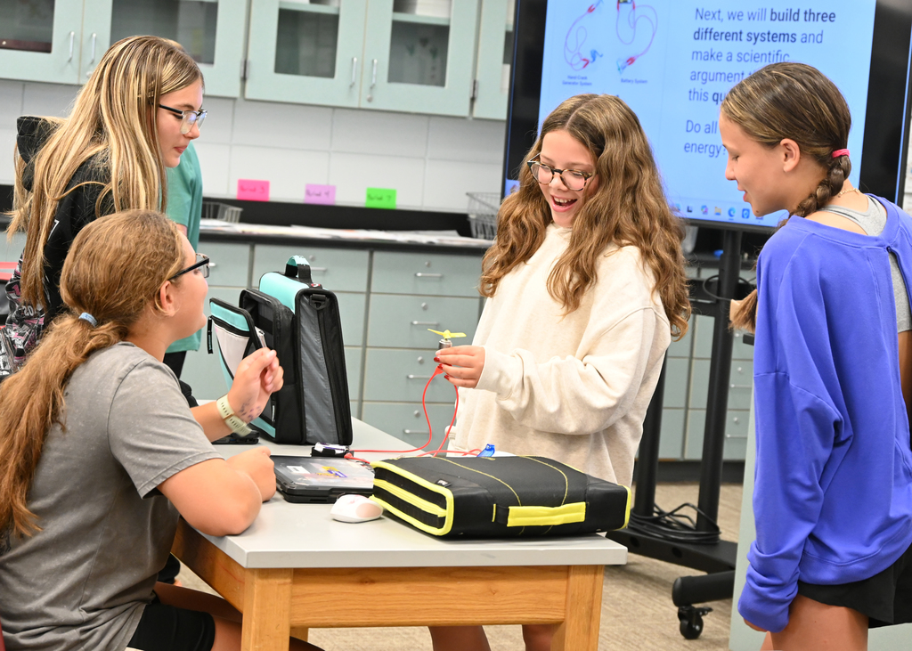 students working with circuits at a desk