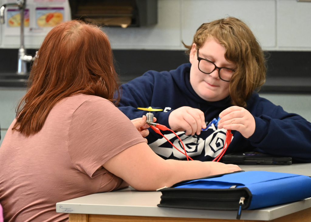 students working with circuits at a desk
