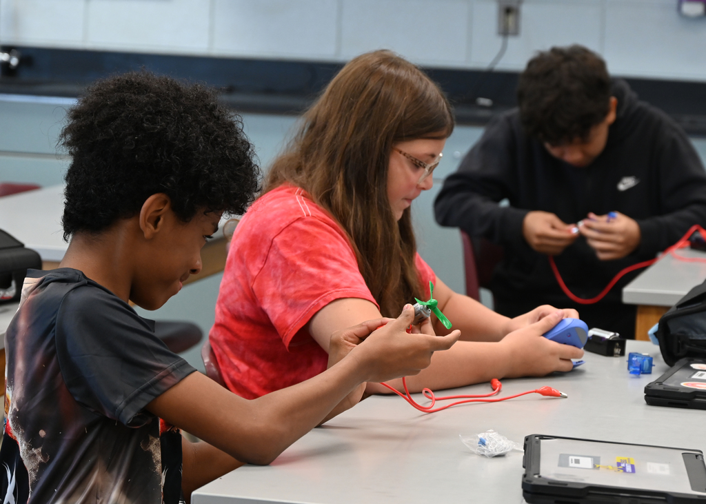 students working with circuits at a desk