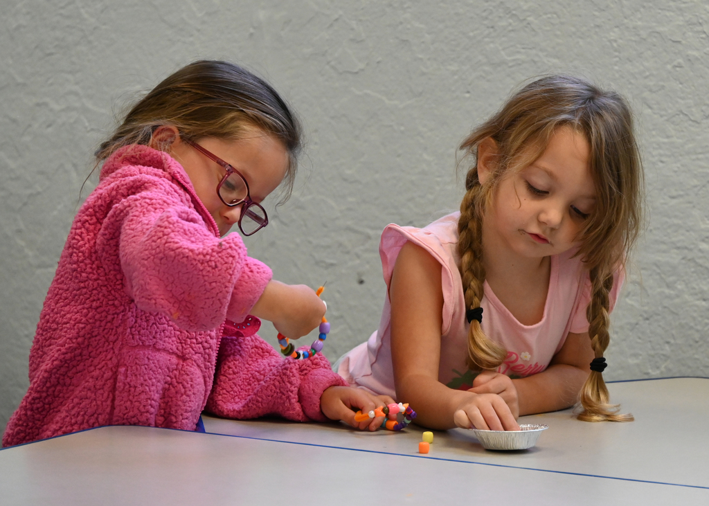 girls using beads