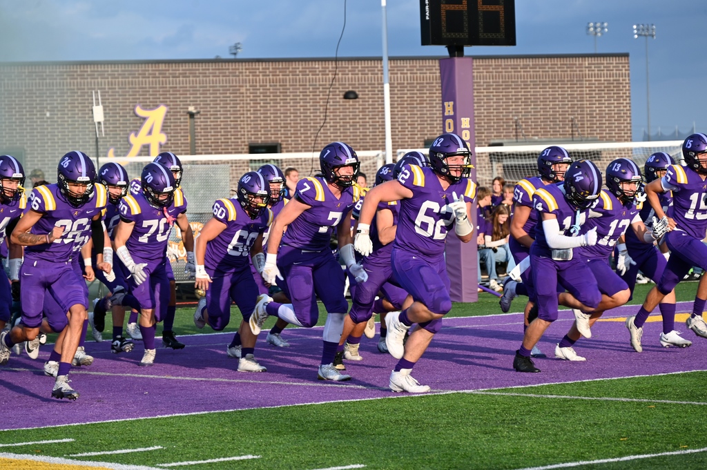 football team running out on field