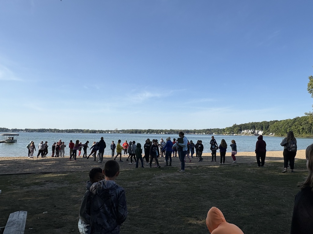 students in from of lake