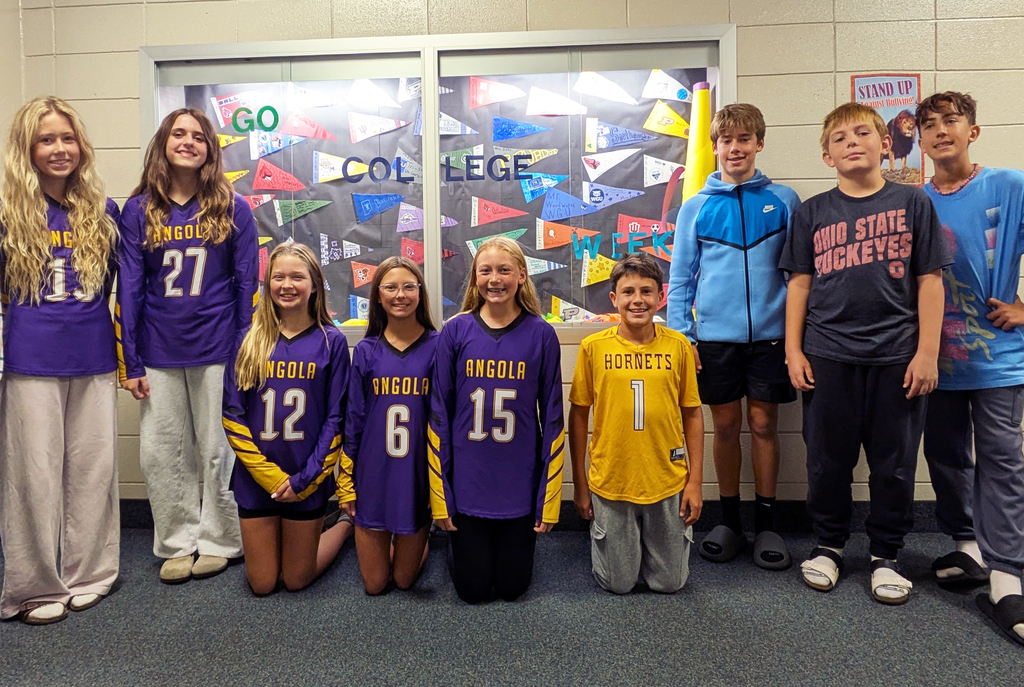 students standing in front of a display