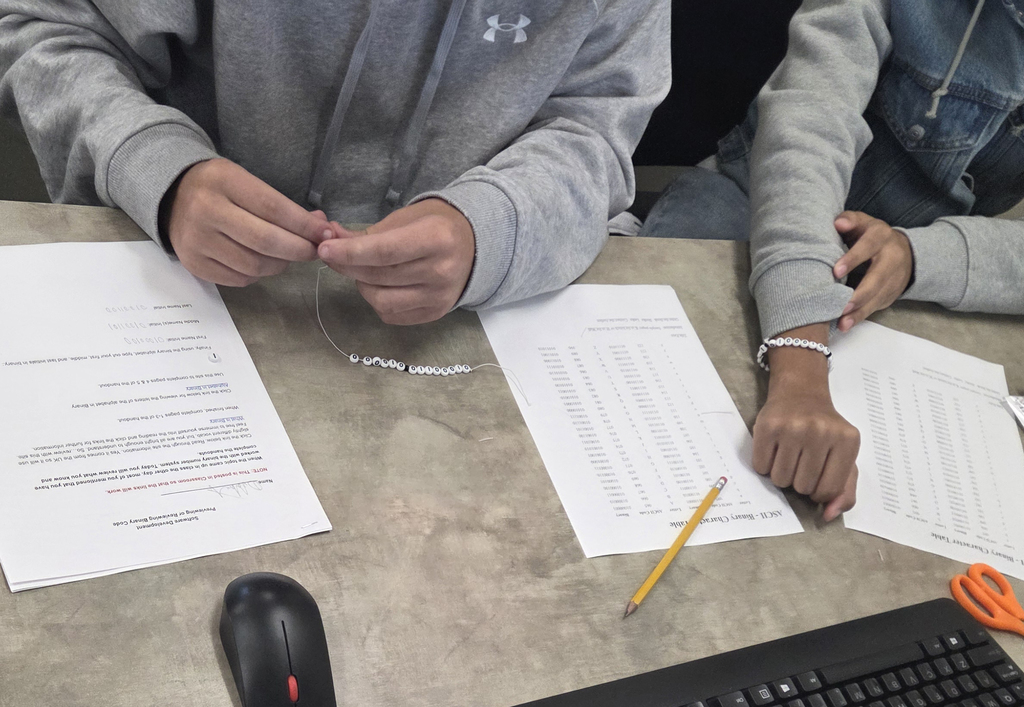 students making binary bracelets
