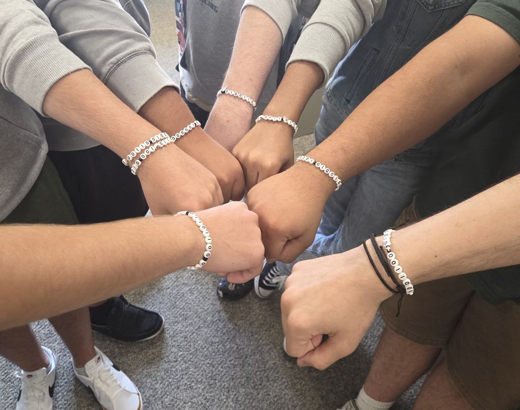 students with binary bracelets
