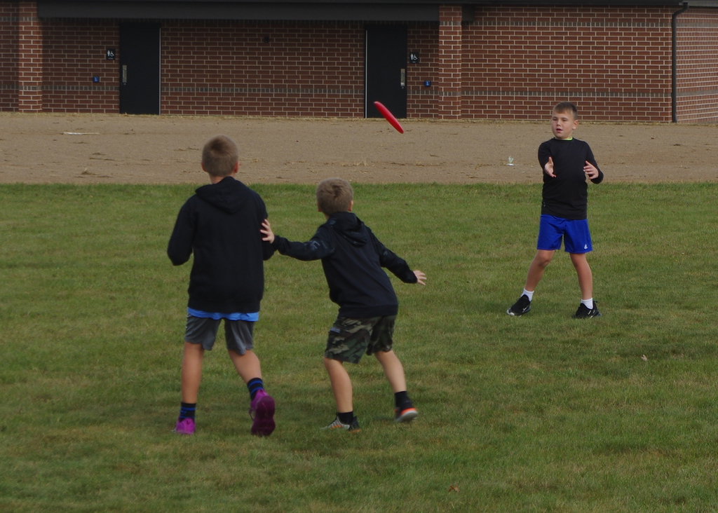 boys playing frisbee