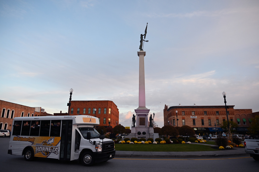 monument and bus driving around it