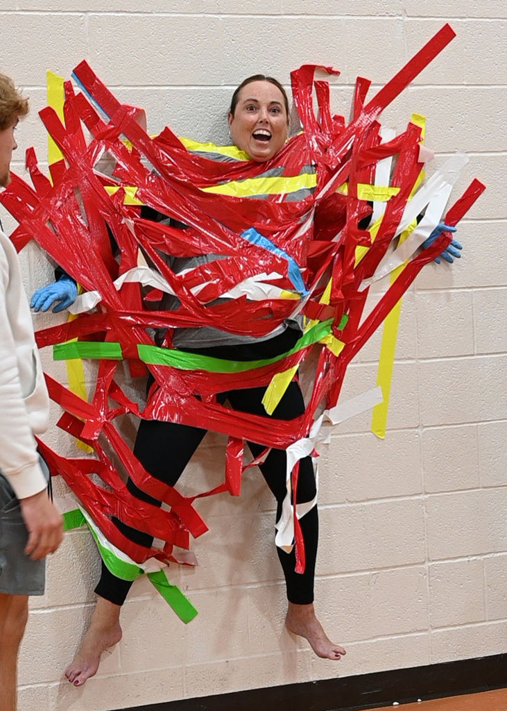 adult being duct taped to wall