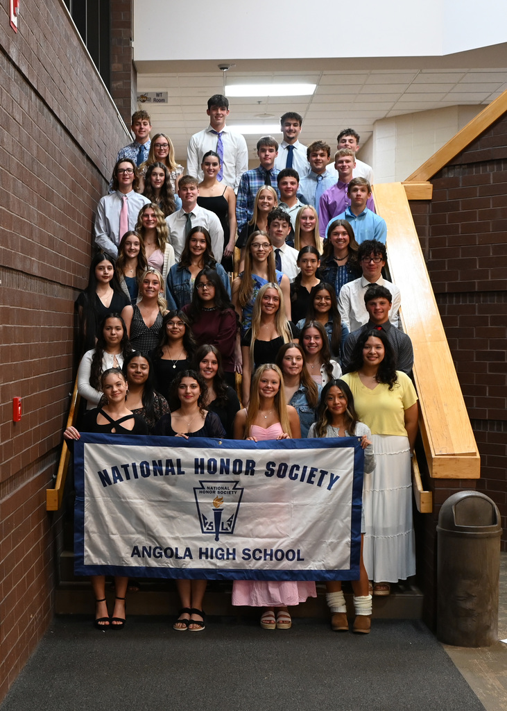 large group of students on stairs posing for a photo
