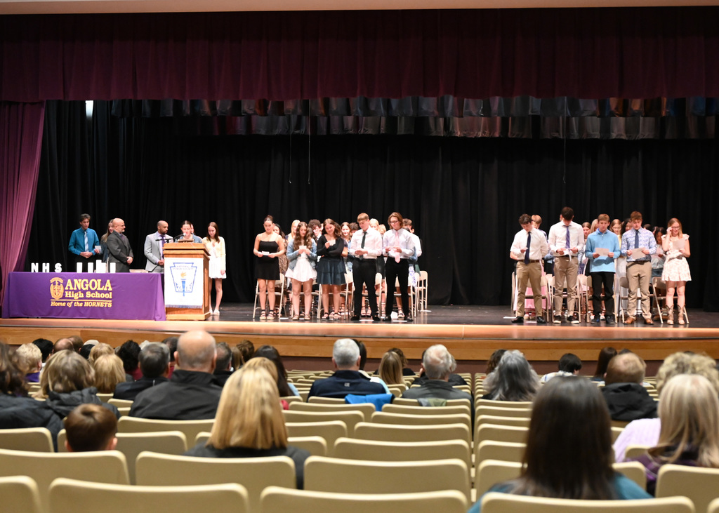 stage with people standing in a group