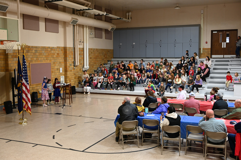 3 girl perfoming in a gym full of people