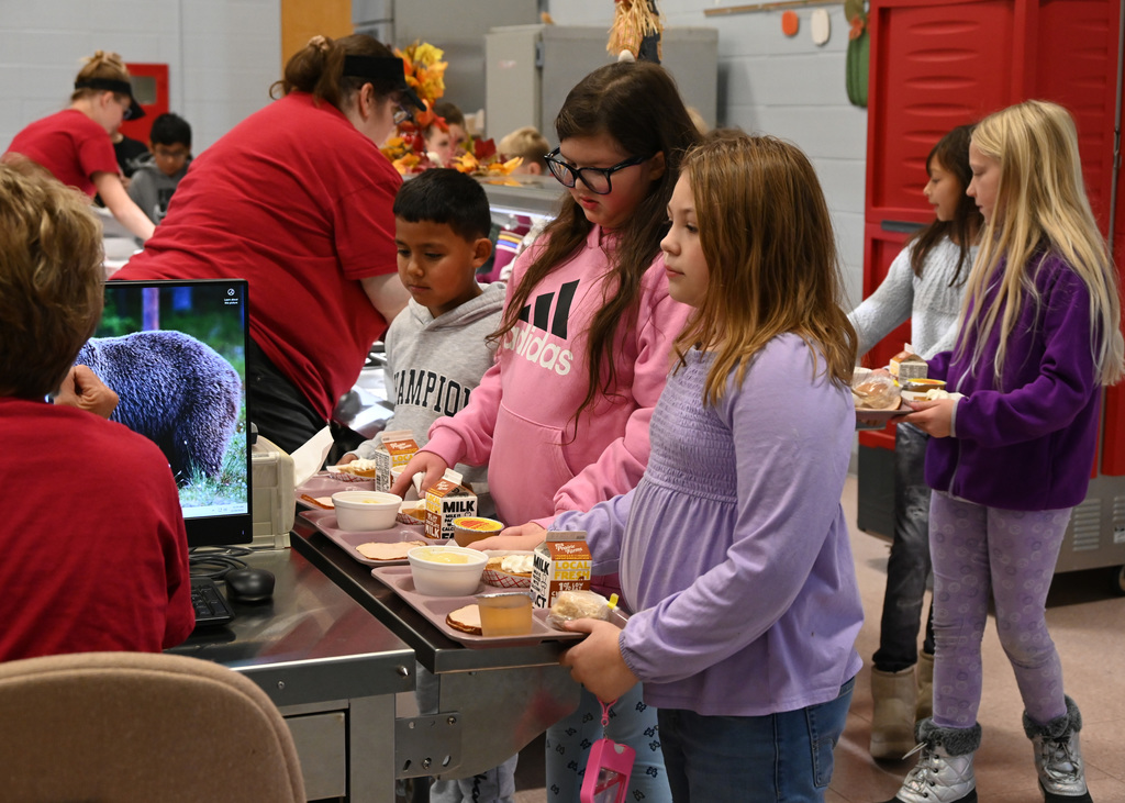 students in school cafeteria line