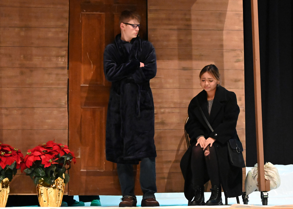 man and woman outside house