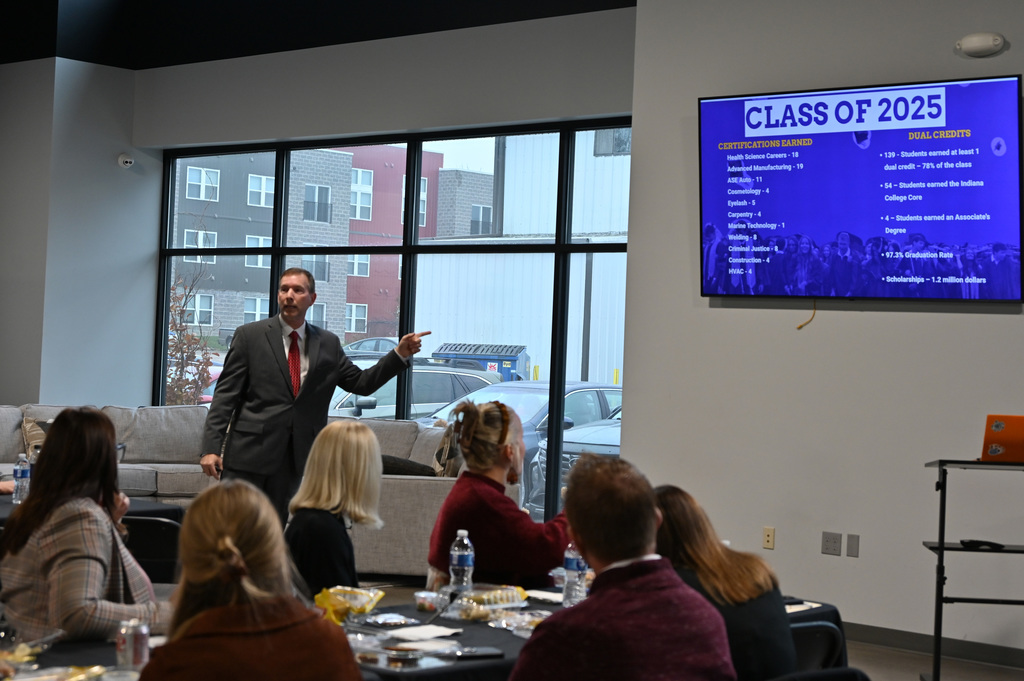 person talking to a group of people