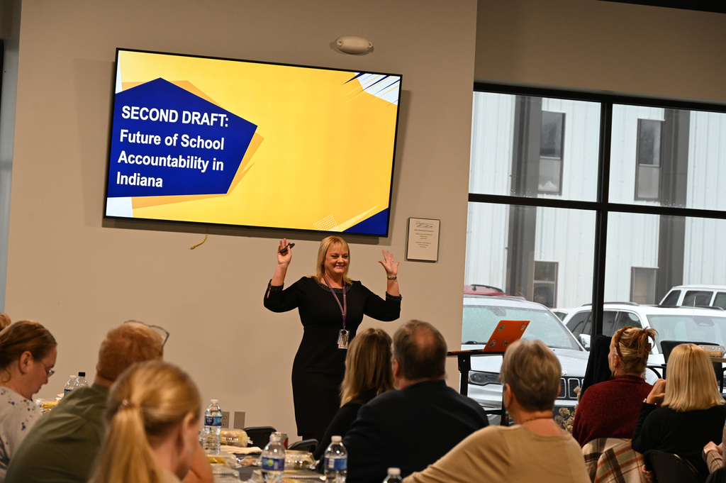 person talking to a group of people