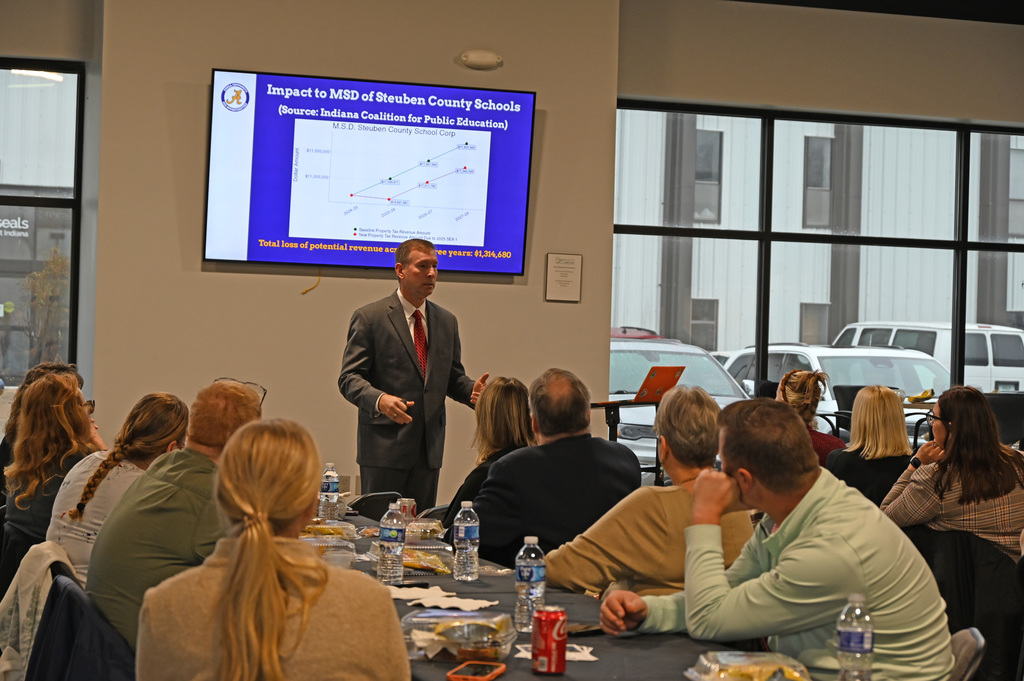 person talking to a group of people