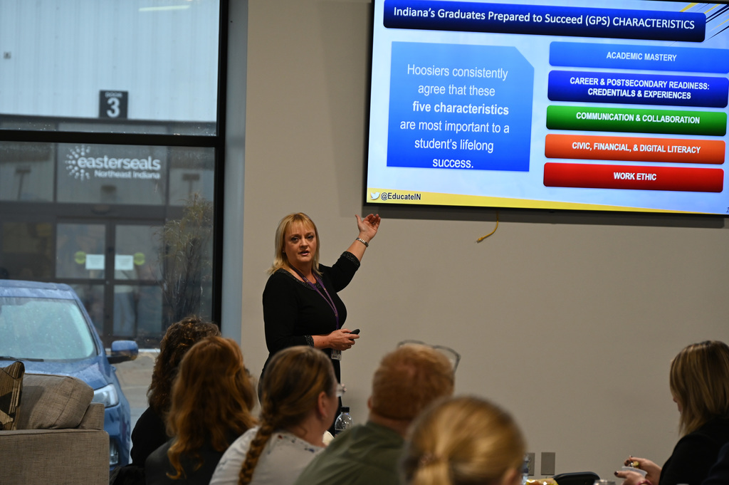 person talking to a group of people
