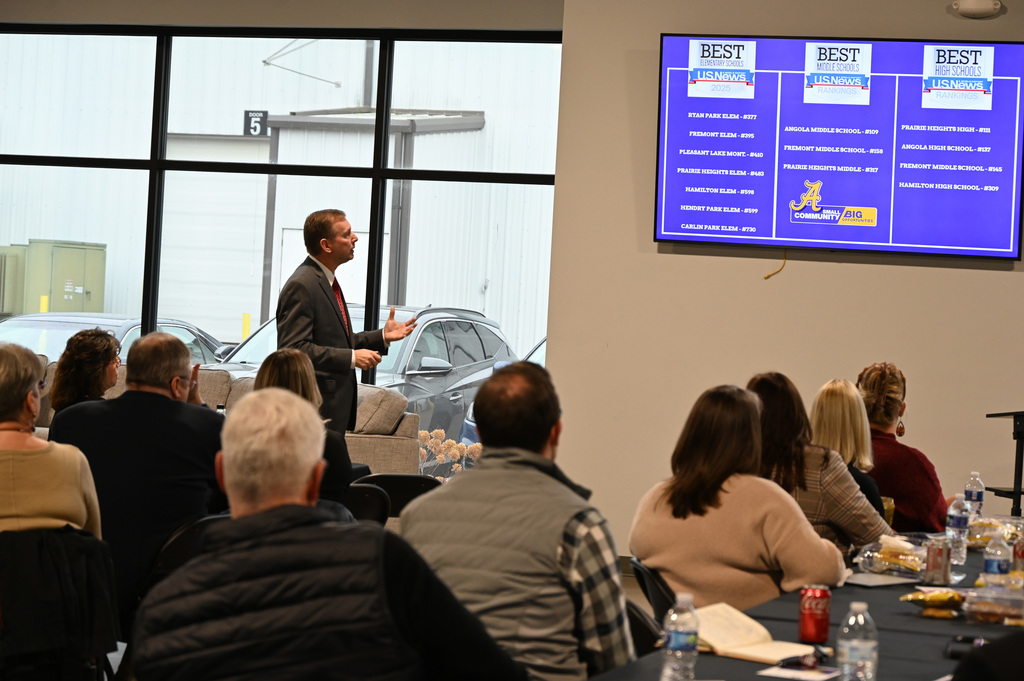 person talking to a group of people