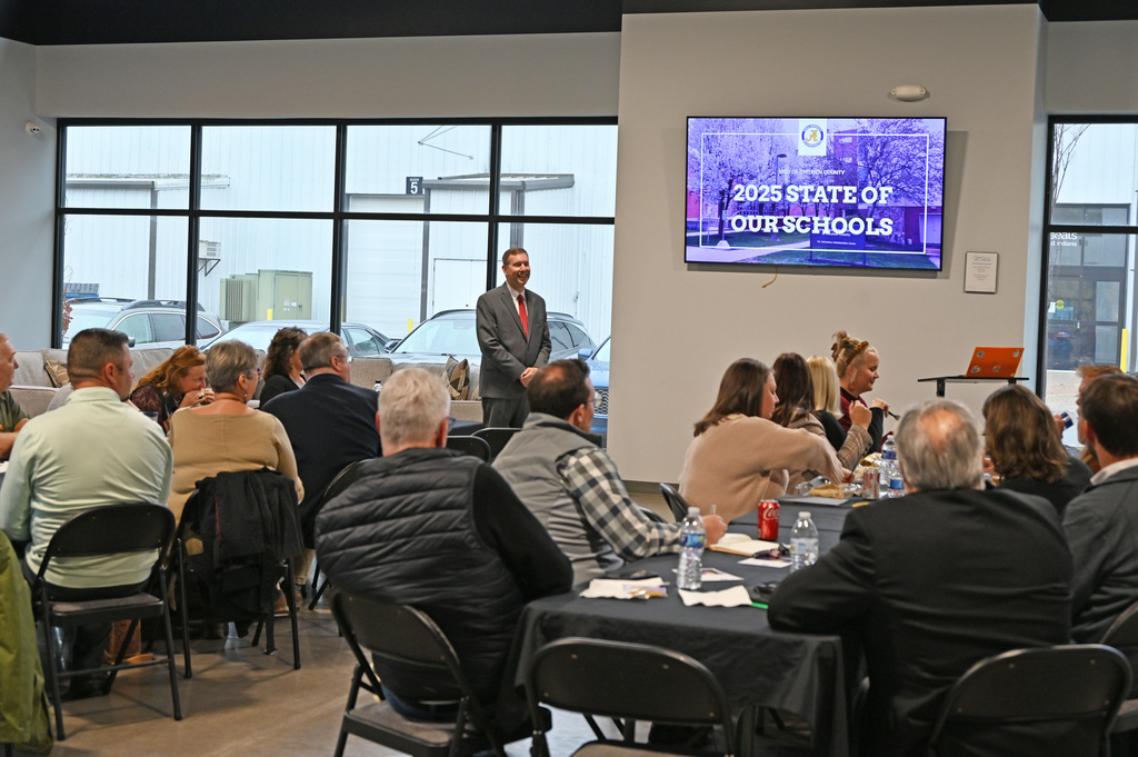 person talking to a group of people