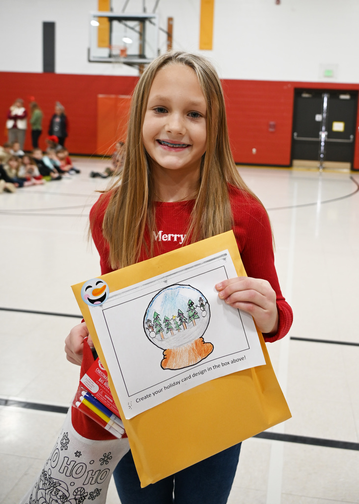 child holding envelope with card they designed