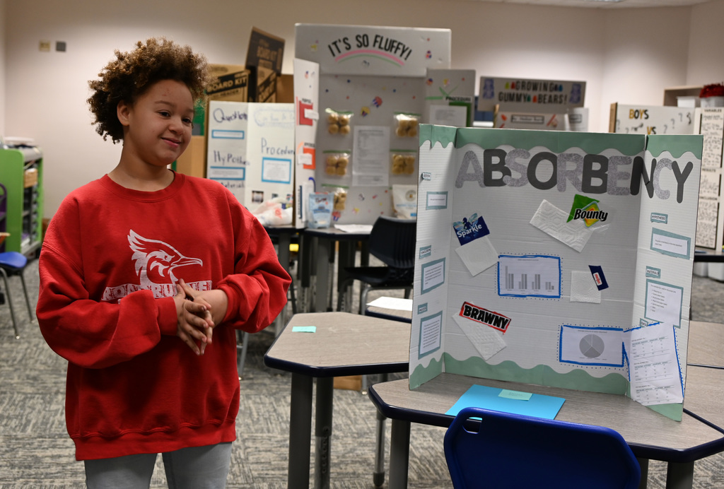 student presenting science fair project