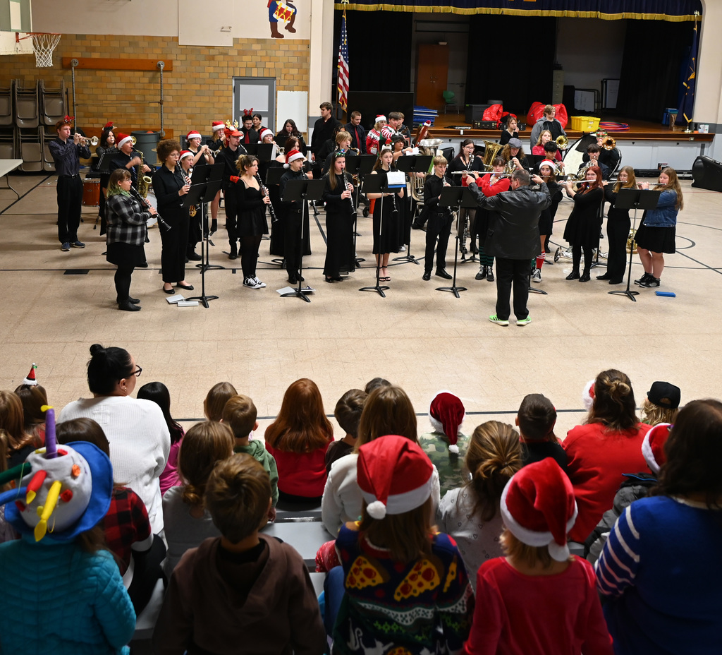 school band playing in front of students