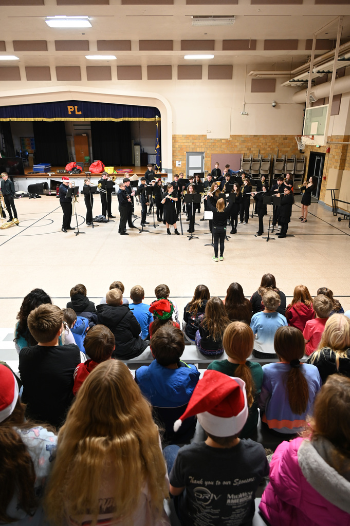 school band playing in front of students