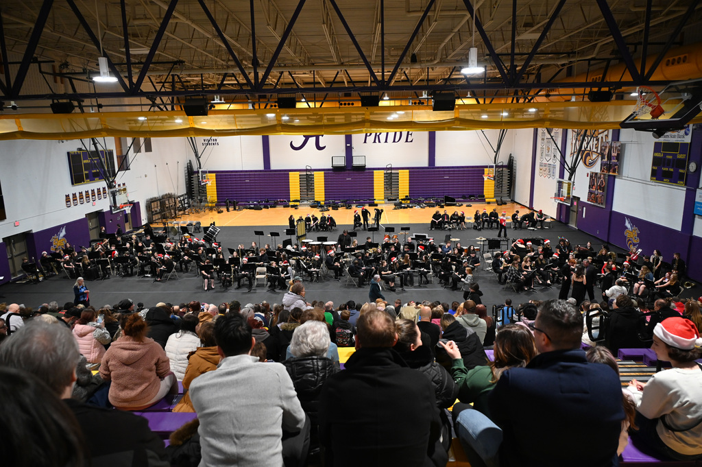 band playing in front of audinece in gym