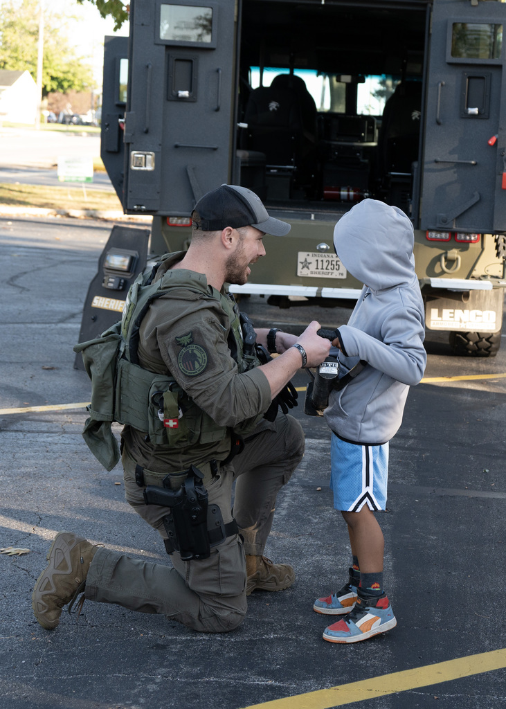 Police officer showing student gear