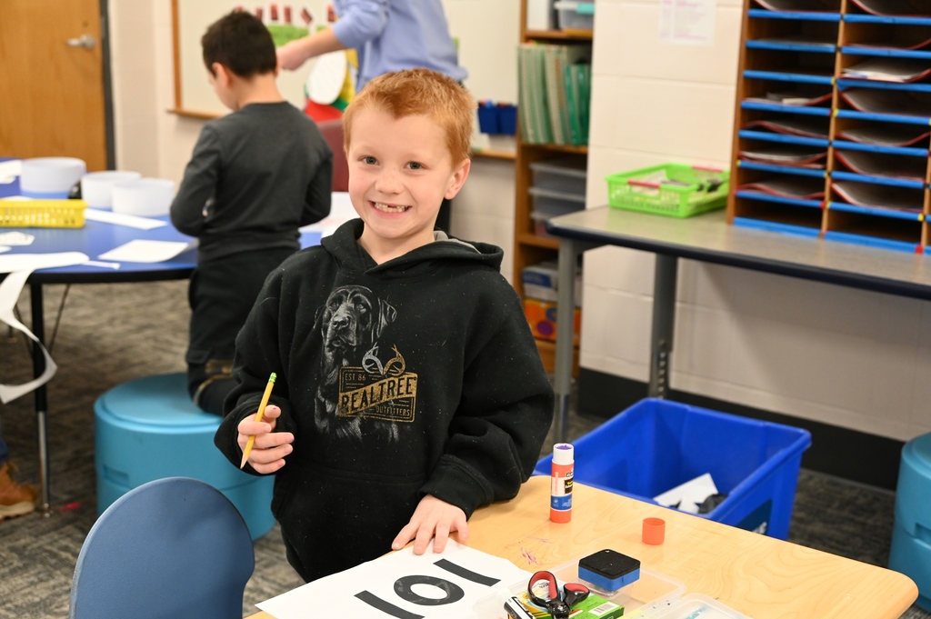boy in classroom smiling