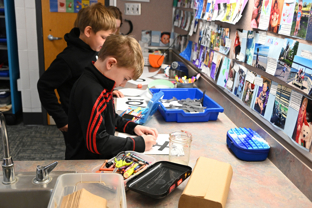 childern working on on a counter