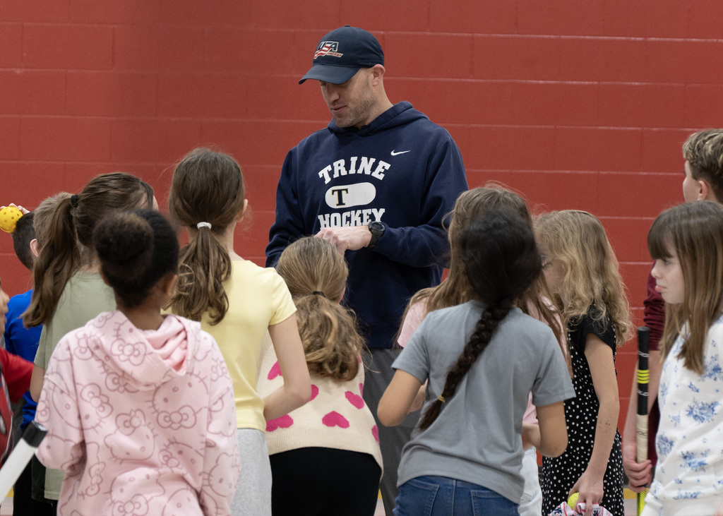 man talking to group of students