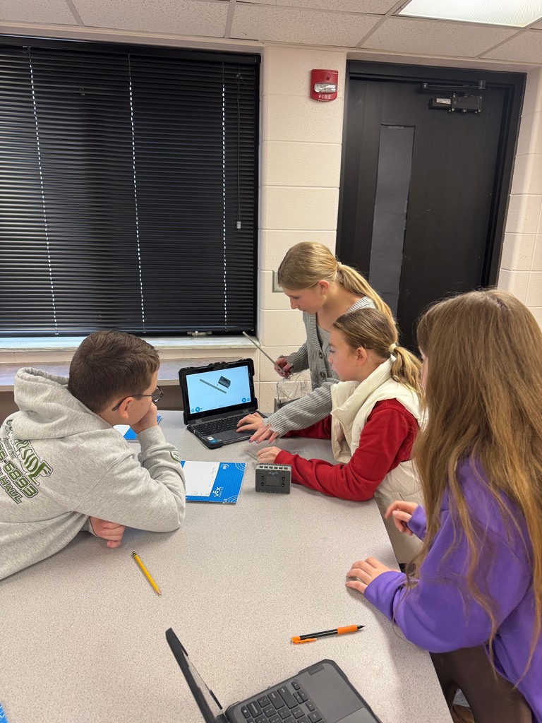 4 students working on a chromebook