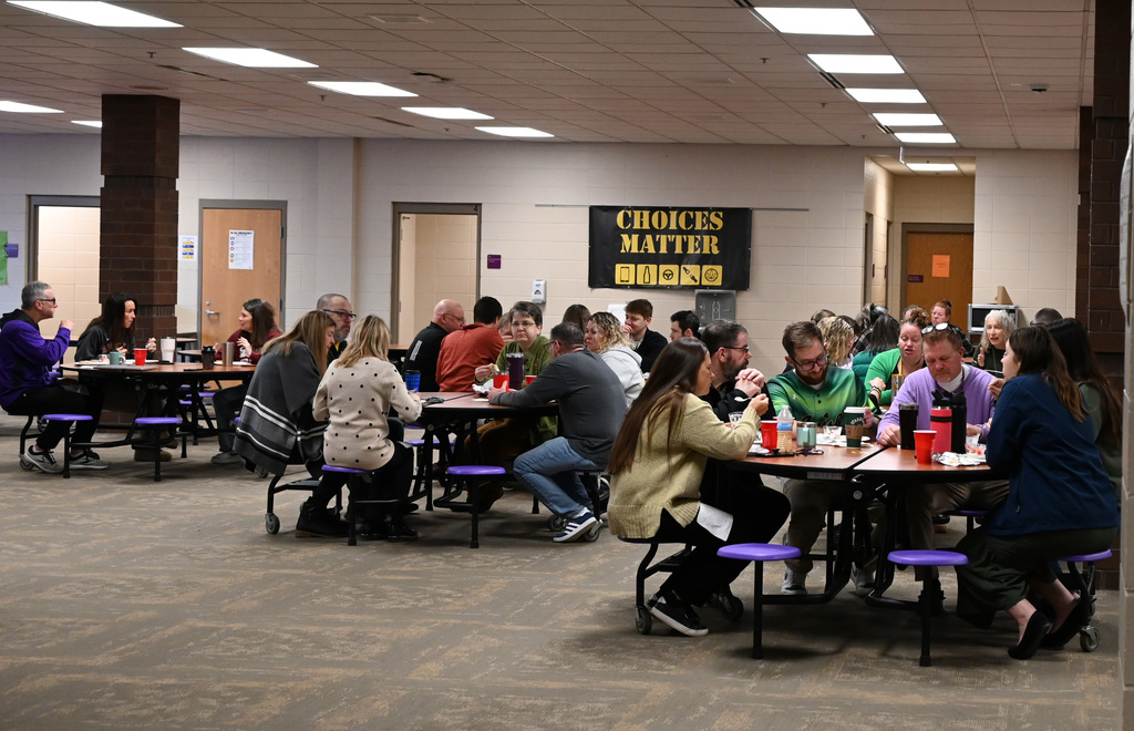 cafeteria full of adults eating