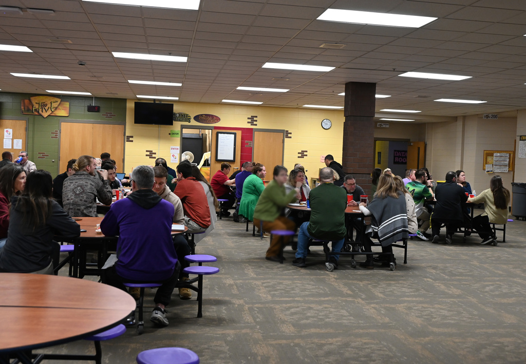 cafeteria full of adults eating