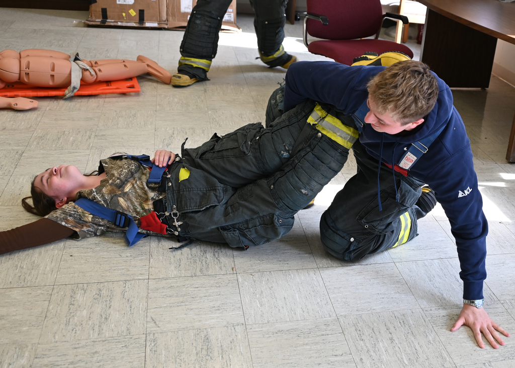 students practacing fire fighter drag