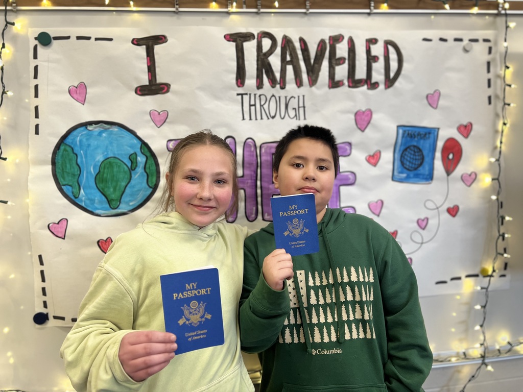 boy and girl holding a passport