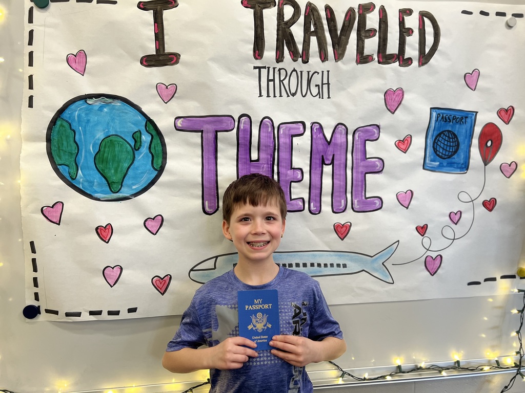 boy posing with a passport