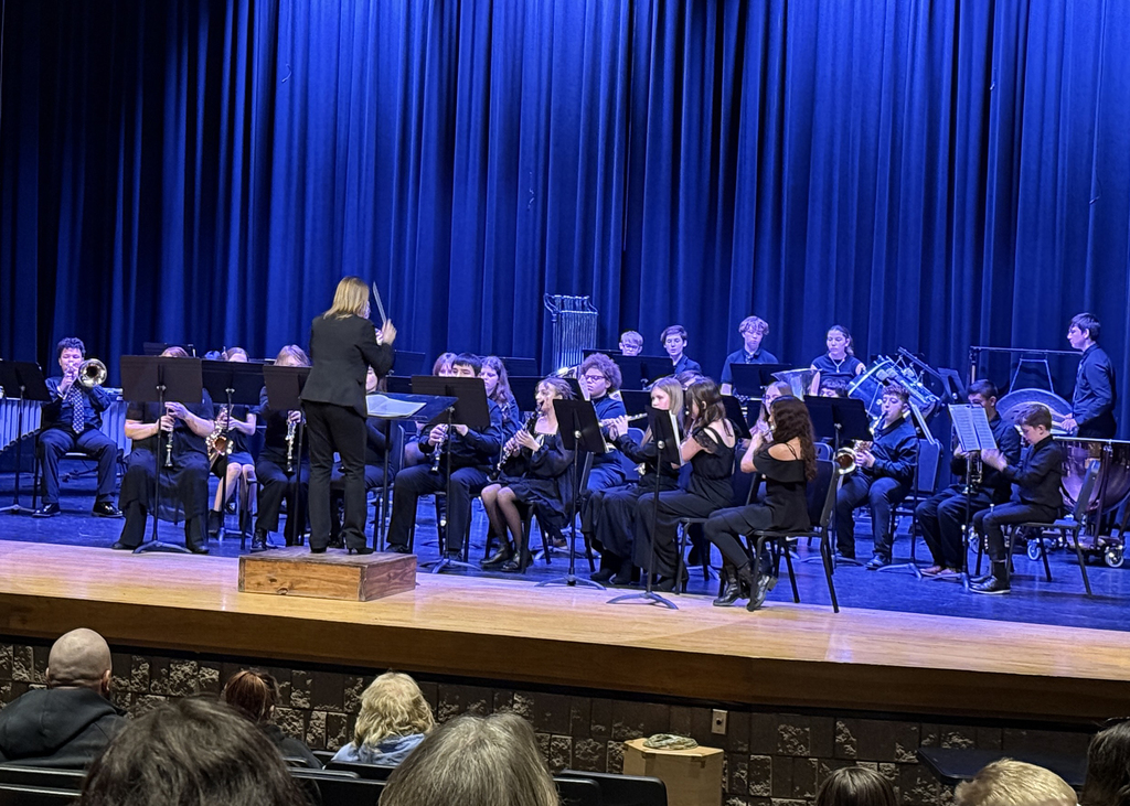 Middle school band on stage performing