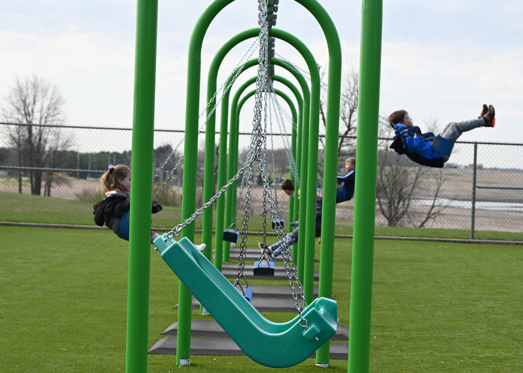 swings with children swinging