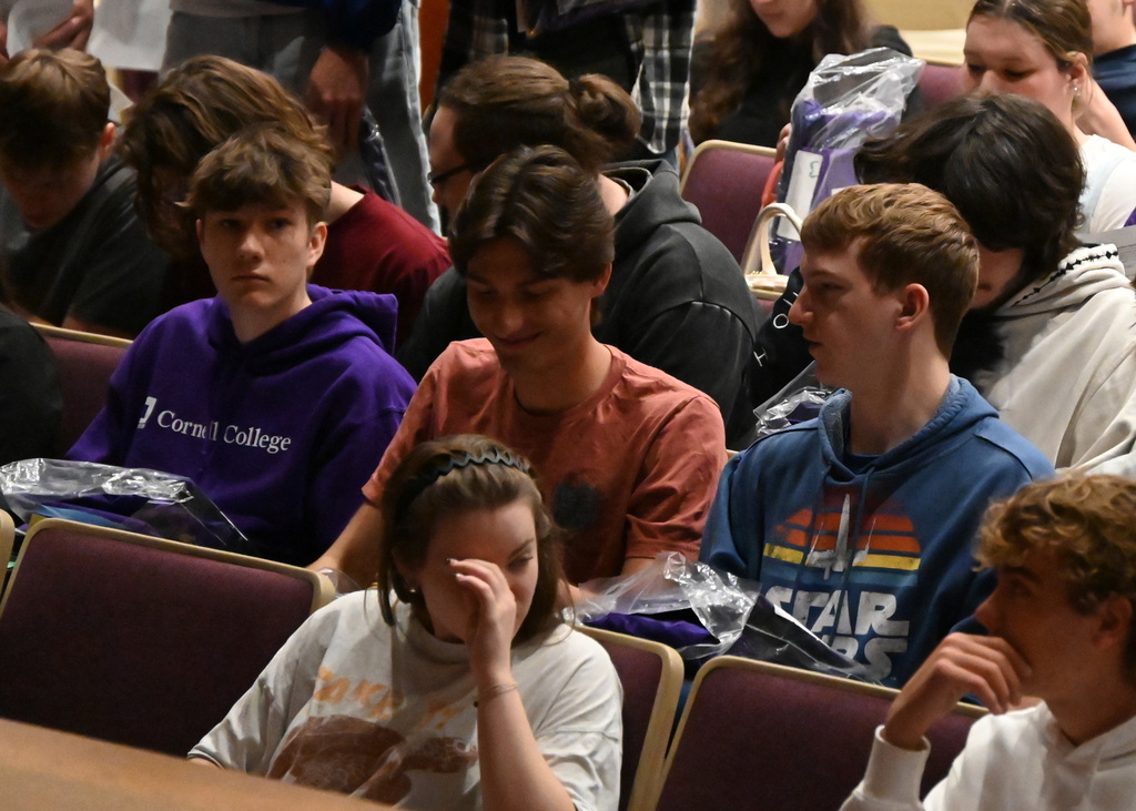students sitting in auditorium