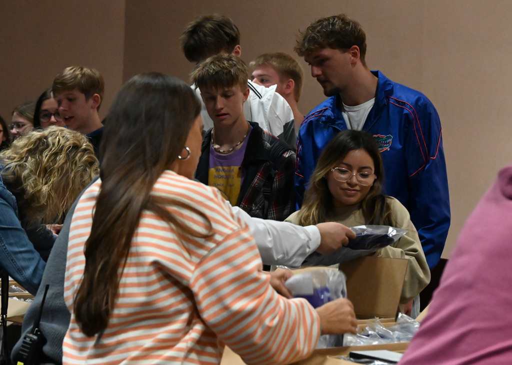Line of students getting packages