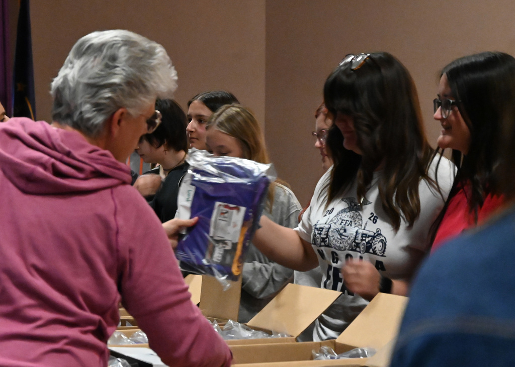 Line of students getting packages
